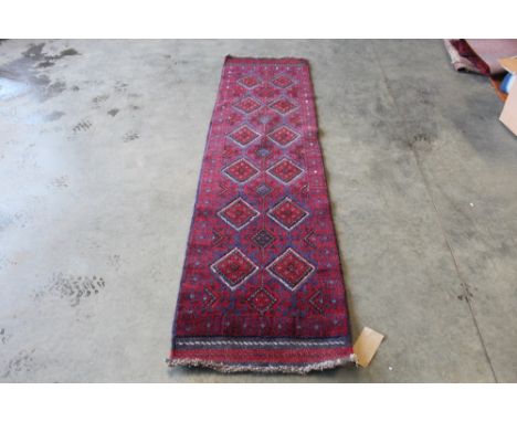 An approx. 8'2" x 2' Meshwani runner