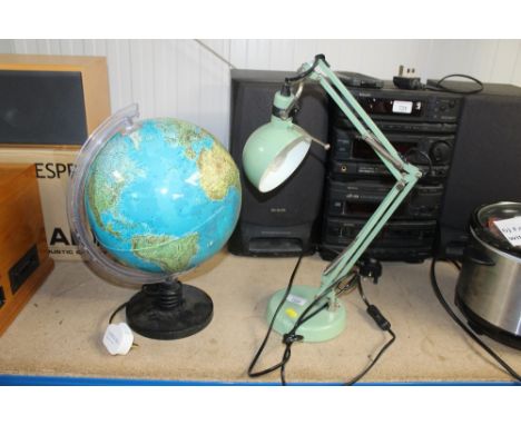 An Ikea angle poise style lamp and illuminating world globe