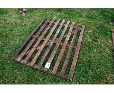 An arch topped slatted wooden gate, 3'9" x 5' high approx.