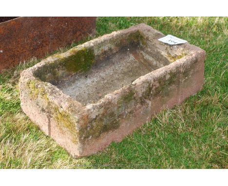 A concrete pig trough.