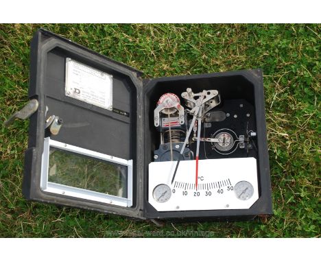 A Drayton Controller with complex internals including centigrade thermometer and with air inlet and outlet ports.