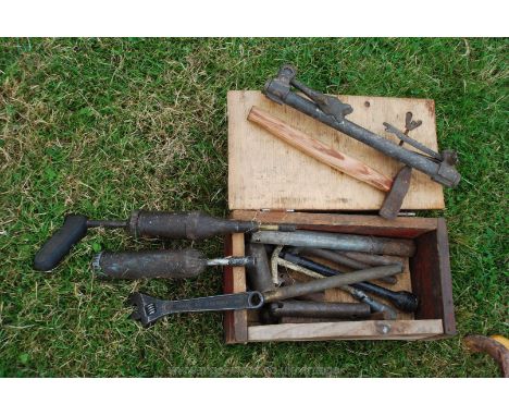 Wooden tool box containing grease gun's, hammer, adjustable spanner etc.