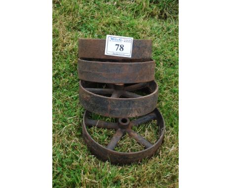 Four cast iron fowl house/engine trolley wheels.