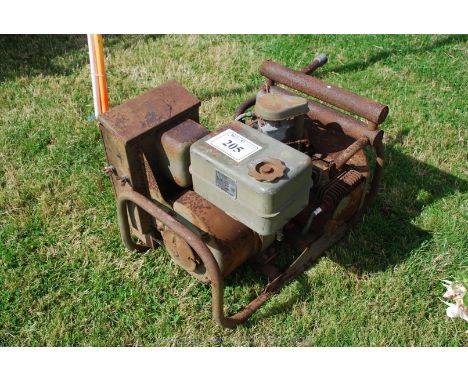 An ex-army Onan twin cylinder model OTC-33H Generator, 2000 w., 15 v., 133 amp, 2300 rpm. serial no. 03-123859.  ''Onan elect