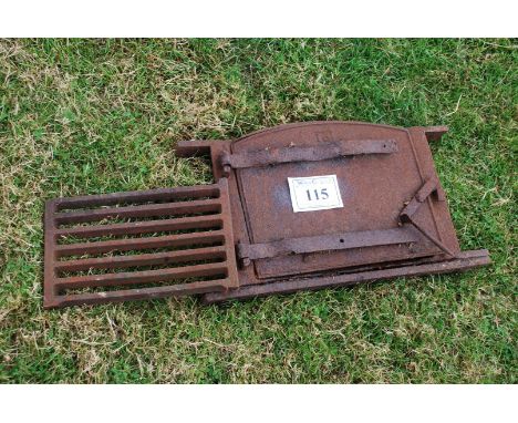 A bread oven door and grate.