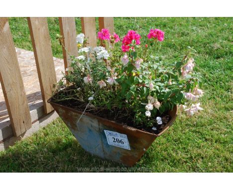 A galvanized trough with flower display.