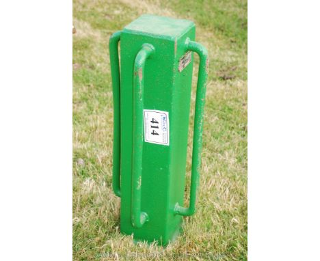 A four handled manual post-rammer. 
