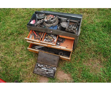 Tool box containing safety goggles, socket set, drill bits, etc.,