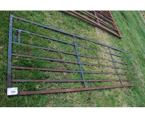 A 12' metal gate with unusual armed cheat-proof latch/bolt.