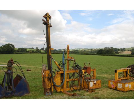 A fork lift type pile driver/rammer, (Very heavy duty).