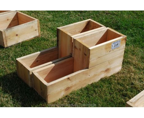 A pair of trough style two-level planters.