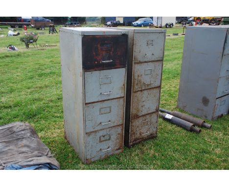 A pair of four drawer filing/tool storage cabinets.