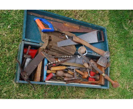 A carpenter's tool chest complete with carpenter's tools including saws, wood augers, marking gauges, a plane, chisels, rules