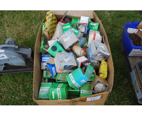A large box of various engine oil and fuel filters.