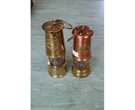 Two vintage brass and copper miners lamps, The Lamp and Limelight Company and The Protector