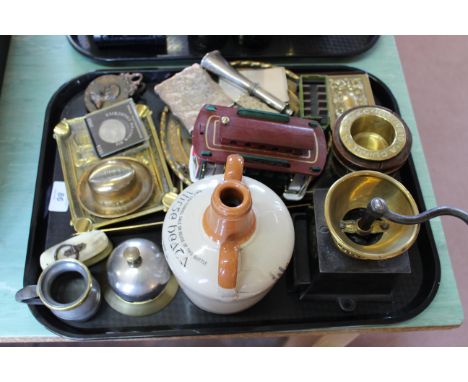 A tray with a Kenrick &amp; Sons coffee grinder, various brass collectors items viz: Battersby Hats match striker, small Salt