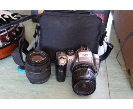 A Canon 300D digital SLR camera with two lenses etc