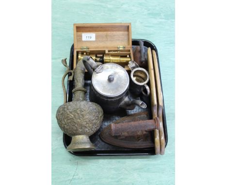 A tray with students microscope, flat irons, butter patts etc