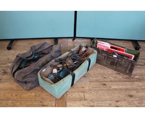 A metal ammunition crate of books and two bags of tools