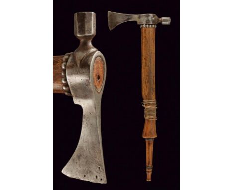 dating: Late 19th Century provenance: North America, Iron-axe, slightly convex-edged head. Block of elongated shape. Handle o