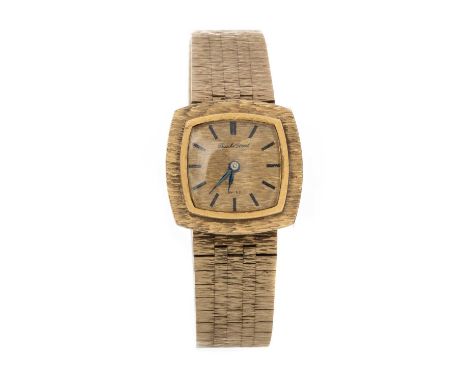 BUECHE GIROD, NINE CARAT GOLD MANUAL WIND WRIST WATCH the textured cushion shaped dial with baton hour markers, 22mm case, to