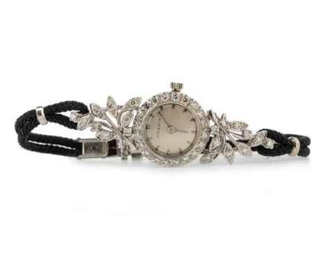 JUVENIA DIAMOND COCKTAIL WATCH, the round dial with wedge hour markers, 16mm case, with floral spray diamond set bezel, marke