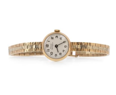 GIRARD PERREGAUX, NINE CARAT GOLD MANUAL WIND WRIST WATCH the round dial with Arabic hour markers, 19mm case on a nine carat 