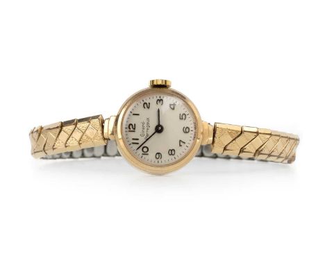 GIRARD PERREGAUX, NINE CARAT GOLD CASED MANUAL WIND WRIST WATCH the round dial with Arabic hour markers, 19mm case, on a gold