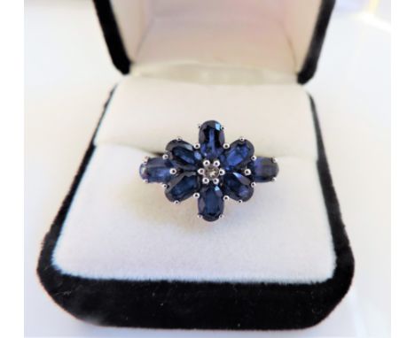 Sterling Silver 5 carat Sapphire Ring 'NEW' with Gift Pouch.  A stunning sterling silver ring set with a cluster of 8 x 6x4mm