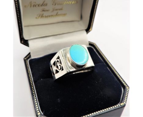 Sterling Silver Artisan Turquoise Ring. Sterling silver ring set with a 9x8mm turquoise stone. Ring is size O. Condition: Ver