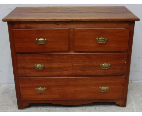 A Victorian mahogany low chest of two short and two long drawers with brass handles and supported on bracket feet. 104 cm wid
