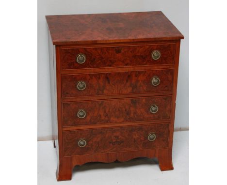 A small burr walnut four drawer chest, with brass ring handles and supported on bracket feet. 57 cm wide