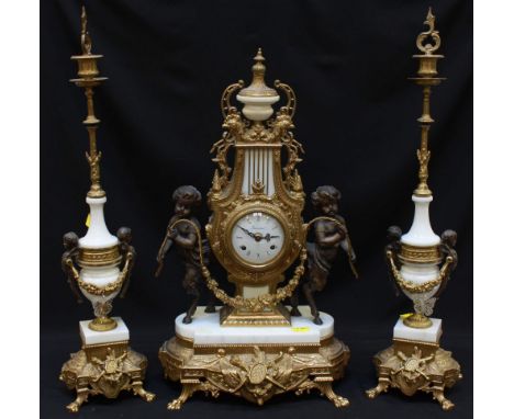 A modern lacquered brass and white marble clock garniture in the 18th century French style, with German eight-day movement st
