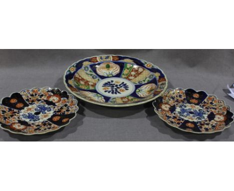 A large 19th century Japanese Imari porcelain charger of lobed form, 40cm diameter, together with a pair of smaller lobed Ima