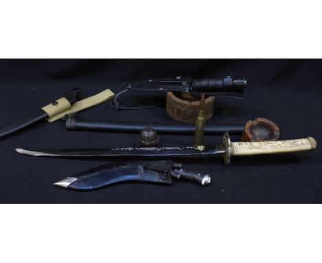 A Japanese reproduction short sword with carved resin grip and plated blade, together with a kukri and scabbard and other ser
