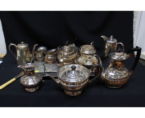 A Viners plated and engraved gallery tray and a four piece tea and coffee set together with a three piece tea service and oth