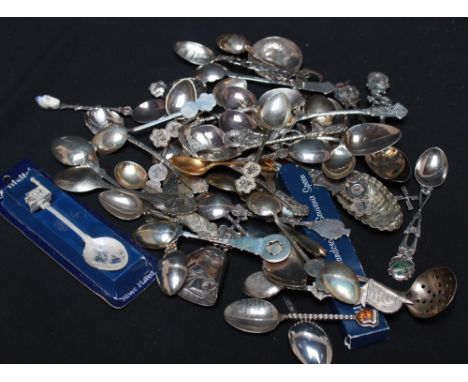 A large collection of souvenir spoons and caddy spoons, etc including some British and Foreign silver examples