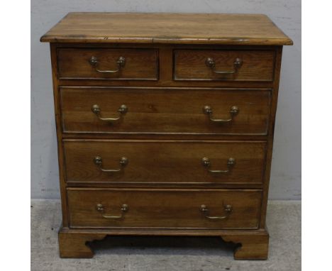 A Reproduction George III style mahogany chest of two short and three long drawers with brass swan neck handles and supported