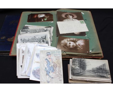 Three albums of assorted early 20th century postcards with subjects including portraits, greetings cards, flowers, sweetheart