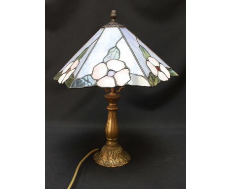 A Tiffany style table lamp, with leaded glass shade decorated with flowers. 41 cm high