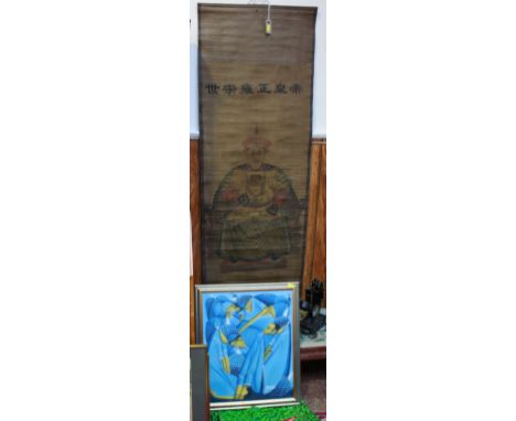 A large Chinese scroll, depicting a seated Emperor dressed in ceremonial robes decorated with dragons, with character marks a