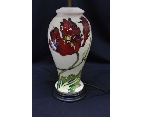 A large modern Moorcroft tube lined table lamp decorated with red poppies on a cream ground, with cream pleated lamp shade