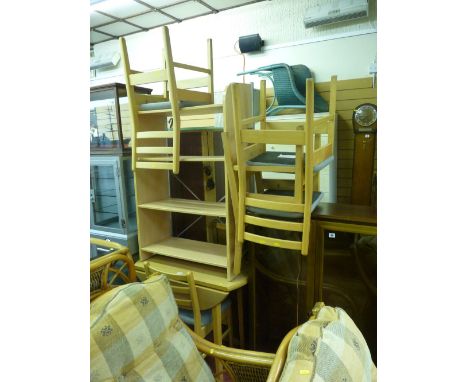 Modern light wood drop leaf dining table and four chairs together with a four shelf bookcase