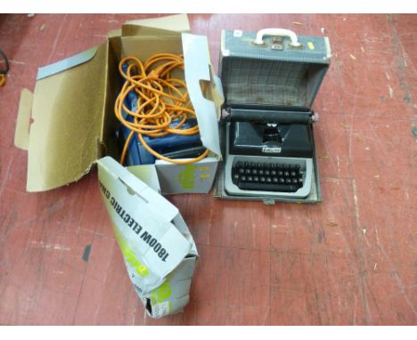 Challenge Extreme chainsaw, model no. SCS718A and a cased vintage typewriter E/T