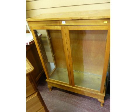 Modern light wood glazed two door display cabinet