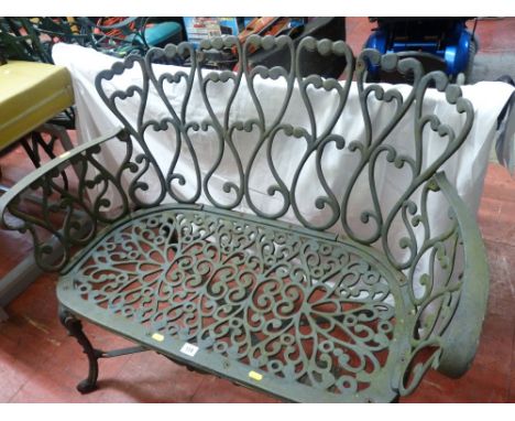 Small metal ornate garden bench