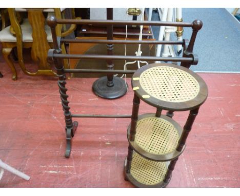 Dark wood towel airer and a circular cane three shelf whatnot