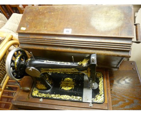 Wooden cased manual Singer sewing machine