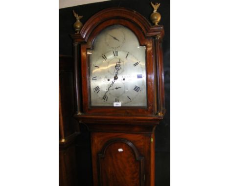 An antique mahogany longcase clock with arched silvered dial, separate seconds and date dials - signed James Windsor, London