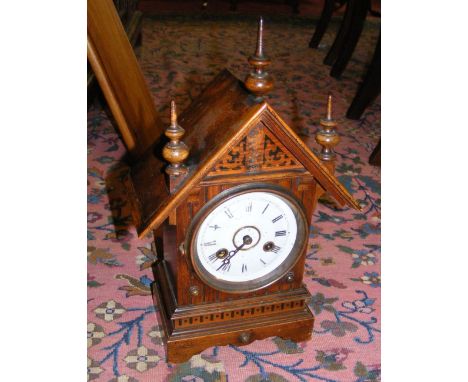 An antique mantel clock with striking movement